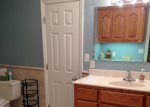 Great upstairs bathroom with a walk in shower with sliding doors.